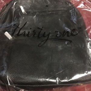 31 back pack purse..... black never used